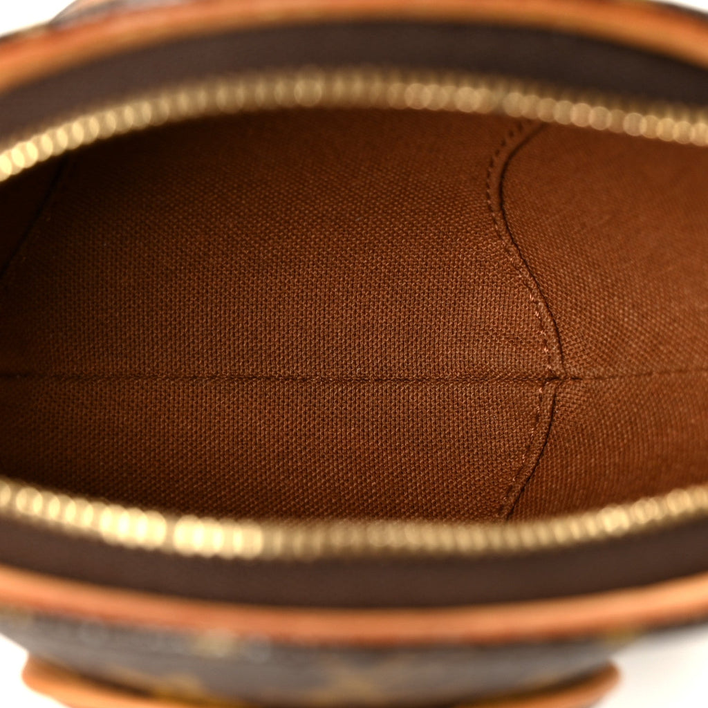 Monogram Mini Ellipse Wristlet Clutch