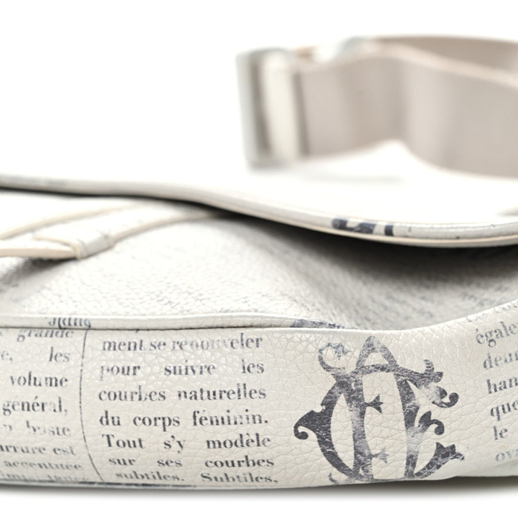 X Daniel Arsham Grained Calfskin Newspaper Print Saddle Bag White
