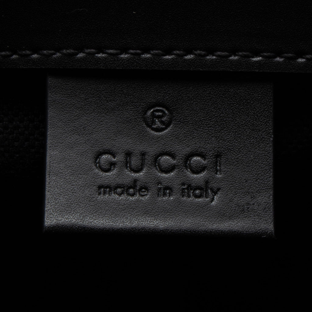 Gucci GG Supreme Medium Flap Backpack