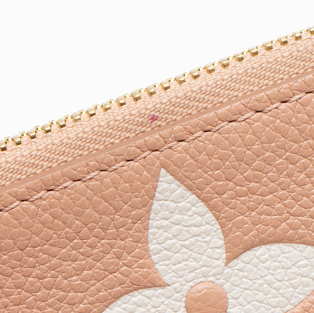 Louis Vuiiton Giant Monogram Empreinte Bicolor Neverfull MM Pochette