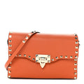 Pebbled Calfskin Medium Rockstud Flip Lock Crossbody Bag Orange